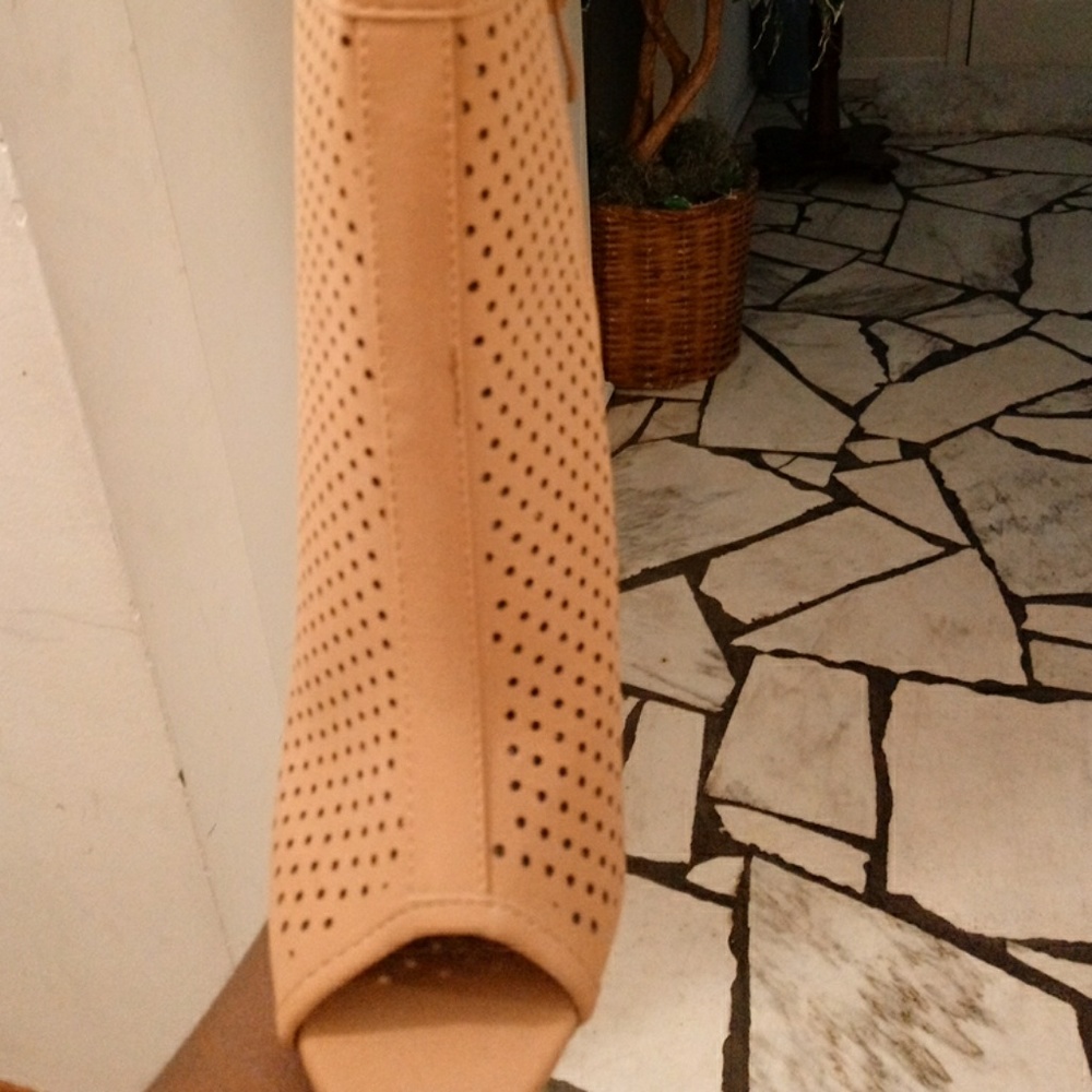 Tan ankle booths. Has never been worn